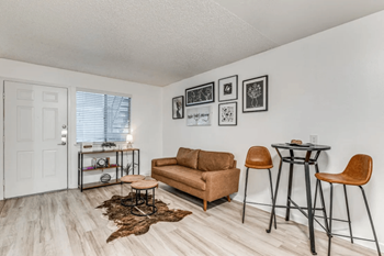 Fusion fort worth living area with hardwood inspired flooring